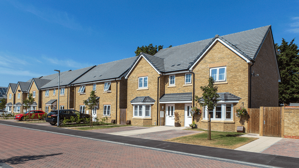white upvc windows and doors on the front of modern detached homes