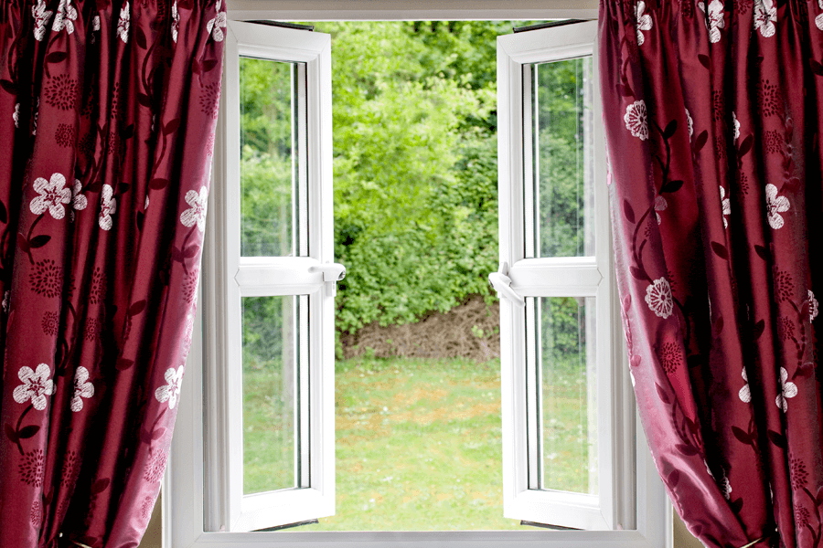 white upvc french windows double glazed opening out into a garden view